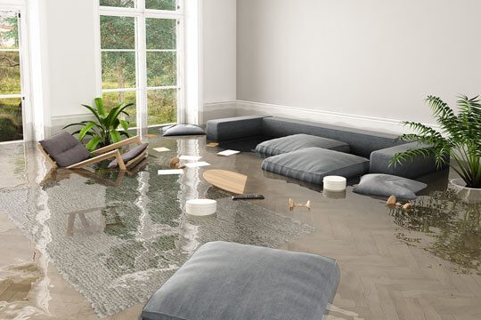 A living room flooded with water and furniture.