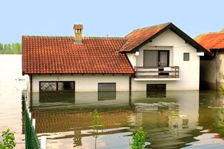 A two-story house flooded by river water