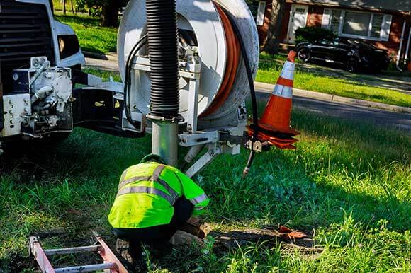 A man working on the side of a road.